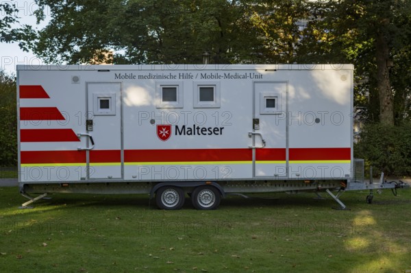 Borken, NRW, Germany, Mobile medical unit from malteser parked on grass, ready to offer medical assistance