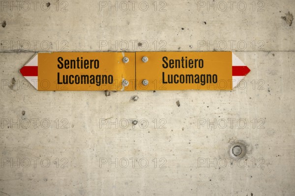 Hiking trail sign in subway on concrete, Sentiero Lucomagno, Lukmanier Trail, Campra, Blenio, Ticino, Switzerland