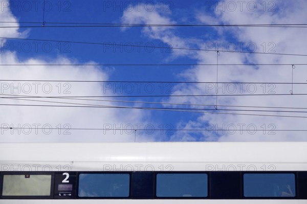 Travelling train, cloudy sky, summer, Germany