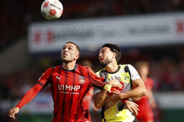 Football, Bundesliga 1, Matchday 3, 2025/2026, 1. FC Heidenheim vs. Borussia Dortmund, 13/09/2025, Voith-Arena, Heidenheim, Germany, Arijon IBRAHIMOVIC 1. FC Heidenheim 22 left in duel with Ramy BENSEBAINI Borussia Dortmund 5