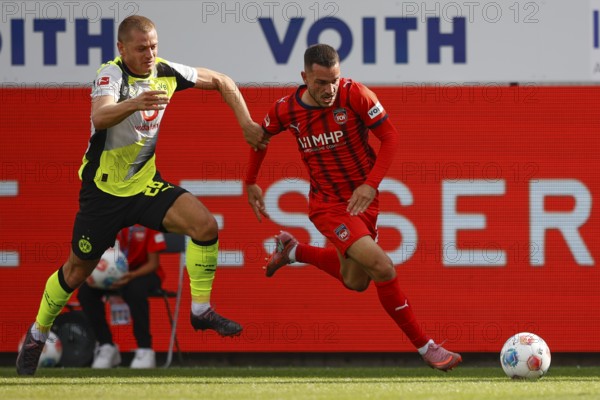 Football, Bundesliga 1, Matchday 3, 2025/2026, 1. FC Heidenheim vs. Borussia Dortmund, 13.09.2025, Voith-Arena, Heidenheim, Germany, Julian RYERSON Borussia Dortmund 26 left in duel with Arijon IBRAHIMOVIC 1. FC Heidenheim 22