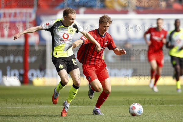 Football, Bundesliga 1, Matchday 3, 2025/2026, 1. FC Heidenheim vs. Borussia Dortmund, 13/09/2025, Voith-Arena, Heidenheim, Germany, Maximilian BEIER Borussia Dortmund 14 left in duel with Jan SCHÖPPNER 1. FC Heidenheim 3