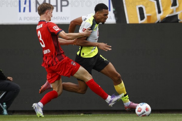 Football, Bundesliga 1, Matchday 3, 2025/2026, 1. FC Heidenheim vs. Borussia Dortmund, 13/09/2025, Voith-Arena, Heidenheim, Germany, Jan SCHÖPPNER 1. FC Heidenheim 3 left in duel with Felix NMECHA Borussia Dortmund 8