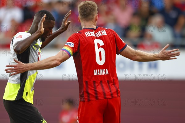 Football, Bundesliga 1, Matchday 3, 2025/2026, 1. FC Heidenheim vs. Borussia Dortmund, 13/09/2025, Voith-Arena, Heidenheim, Germany, Serhou GUIRASSY Borussia Dortmund 9 left in duel with Patrick MAINKA 1. FC Heidenheim 6