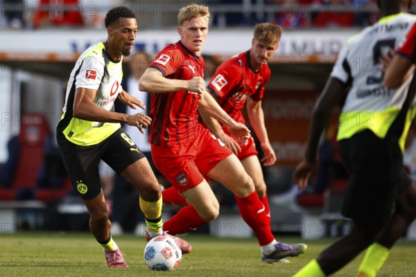 Football, Bundesliga 1, Matchday 3, 2025/2026, 1. FC Heidenheim vs. Borussia Dortmund, 13.09.2025, Voith-Arena, Heidenheim, Germany, Felix NMECHA Borussia Dortmund 8 left in duel with Mikkel KAUFMANN 1. FC Heidenheim