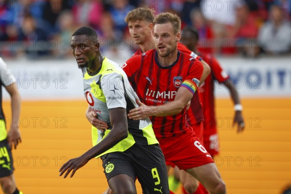 Football, Bundesliga 1, Matchday 3, 2025/2026, 1. FC Heidenheim vs. Borussia Dortmund, 13/09/2025, Voith-Arena, Heidenheim, Germany, Serhou GUIRASSY Borussia Dortmund 9 left in duel with Patrick MAINKA 1. FC Heidenheim 6