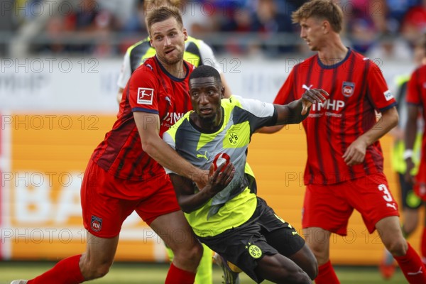 Football, Bundesliga 1, Matchday 3, 2025/2026, 1. FC Heidenheim vs. Borussia Dortmund, 13.09.2025, Voith-Arena, Heidenheim, Germany, Patrick MAINKA 1. FC Heidenheim 6 left in duel with Serhou GUIRASSY Borussia Dortmund 9