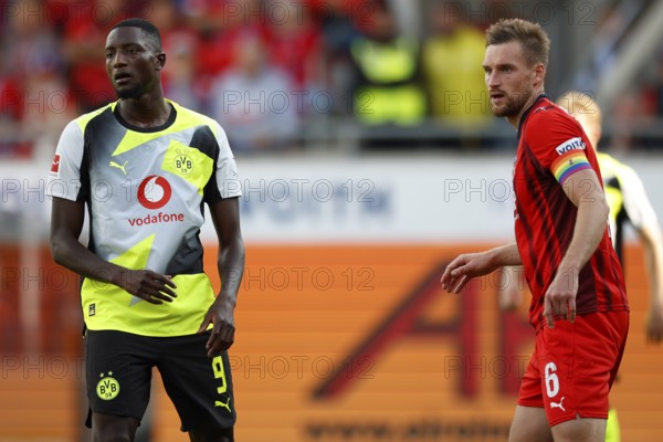 Football, Bundesliga 1, Matchday 3, 2025/2026, 1. FC Heidenheim vs. Borussia Dortmund, 13/09/2025, Voith-Arena, Heidenheim, Germany, Serhou GUIRASSY Borussia Dortmund 9 left in duel with Patrick MAINKA 1. FC Heidenheim 6