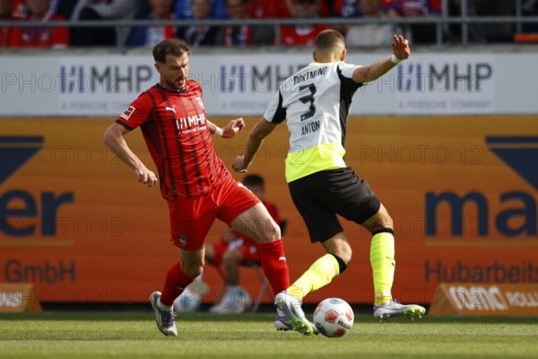 Football, Bundesliga 1, Matchday 3, 2025/2026, 1. FC Heidenheim vs. Borussia Dortmund, 13.09.2025, Voith-Arena, Heidenheim, Germany, Budu ZIVZIVADZE 1. FC Heidenheim 11 left in duel with Waldemar ANTON Borussia Dortmund 3