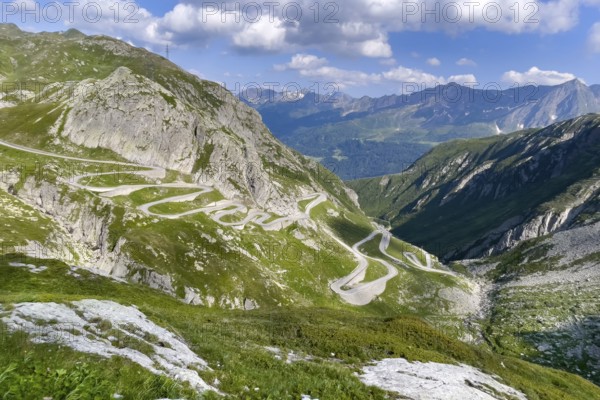 View from elevated position on serpentine hairpin bends of southern ramp southern ascent descent in southern part of old historic St. Gotthard pass road Tremola Gotthardpass Alpine pass mountain road with cobblestones, Swiss Alps, Airolo, Canton Ticino, Ticino, Switzerland