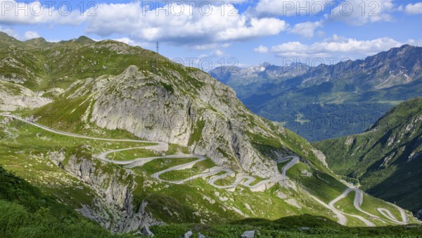 View from elevated position on serpentine hairpin bends of southern ramp southern ascent departure in southern part of old historic St. Gotthard pass road Tremola Gotthardpass Alpine pass mountain road with cobblestones, Swiss Alps, Airolo, Canton Ticino, Ticino, Switzerland