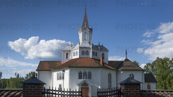 White church building with tiled roofs, Tangen kirke or church, Olavsweg or Olavsleden, pilgrimage route, Tangen, Stange municipality, Norway