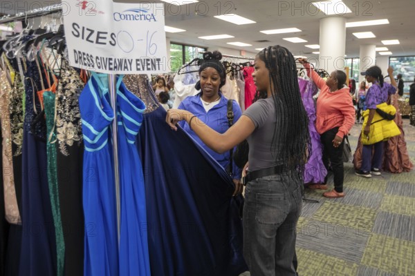 Detroit, Michigan USA - 13 September 2025 - High school students search for free homecoming dresses at a formal dress giveaway sponsored by Comerica Bank and the Jackets for Jobs nonprofit. The organizations expected to give away 500 dresses during the two-day event