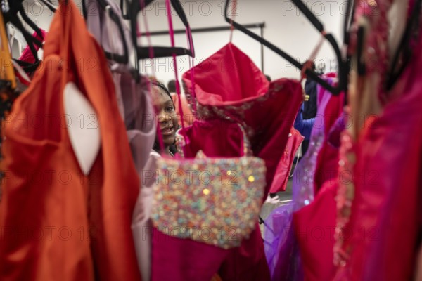 Detroit, Michigan USA - 13 September 2025 - High school students search for free homecoming dresses at a formal dress giveaway sponsored by Comerica Bank and the Jackets for Jobs nonprofit. The organizations expected to give away 500 dresses during the two-day event