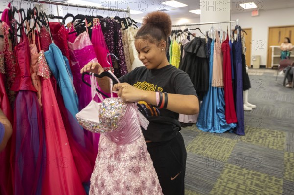Detroit, Michigan USA - 13 September 2025 - High school students search for free homecoming dresses at a formal dress giveaway sponsored by Comerica Bank and the Jackets for Jobs nonprofit. The organizations expected to give away 500 dresses during the two-day event