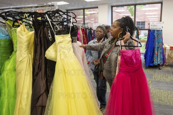 Detroit, Michigan USA - 13 September 2025 - High school students search for free homecoming dresses at a formal dress giveaway sponsored by Comerica Bank and the Jackets for Jobs nonprofit. The organizations expected to give away 500 dresses during the two-day event