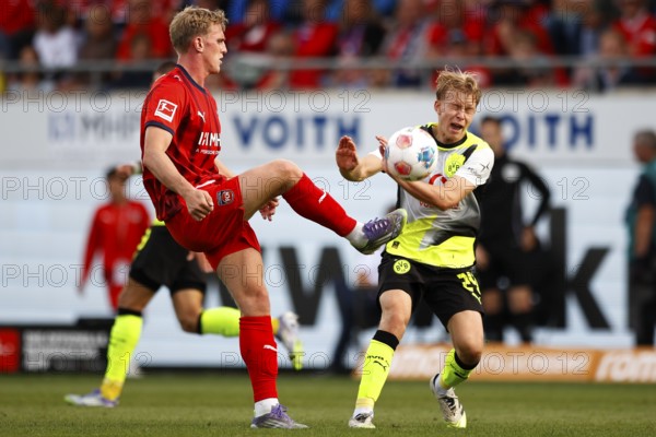 Football, Bundesliga 1, Matchday 3, 2025/2026, 1. FC Heidenheim vs. Borussia Dortmund, 13/09/2025, Voith-Arena, Heidenheim, Germany, Mikkel KAUFMANN 1. FC Heidenheim left in duel with Daniel SVENSSON Borussia Dortmund 24