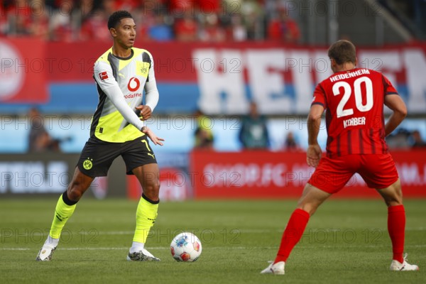 Football, Bundesliga 1, Matchday 3, 2025/2026, 1. FC Heidenheim vs. Borussia Dortmund, 13.09.2025, Voith-Arena, Heidenheim, Germany, Jobe BELLINGHAM Borussia Dortmund 7 left in duel with Luca KERBER 1. FC Heidenheim 20