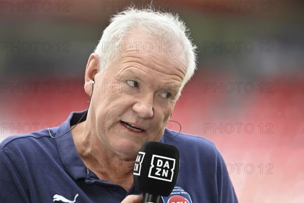 Chairman of the Board Managing Director Holger Sanwald 1. FC Heidenheim 1846 FCH Portrait in interview Microphone Micro Logo DAZN Voith-Arena, Heidenheim, Baden-Württemberg, Germany