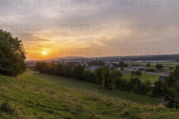 Sunset at the village of Erlen, behind Ottenberg near Weinfelden, Thurgau, Switzerland