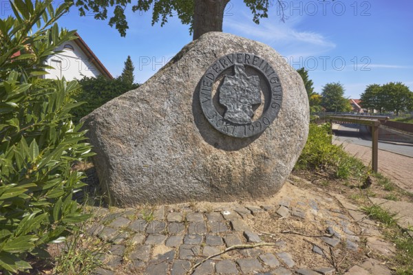 Monument, political event, reunification, flower bed, shrub, trees, cobblestone path, blue sky, cirrostratus clouds, Alte Schulstraße, Alfhausen, district of Osnabrück, Lower Saxony, Germany