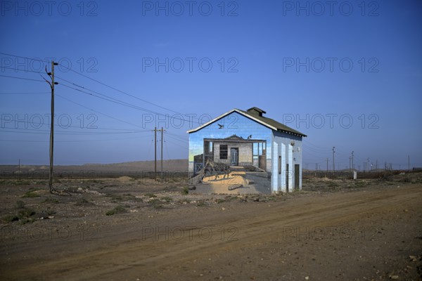 Painted house facade, graffito, brown hyena, diamonds, Oranjemund, Karas region, Namibia