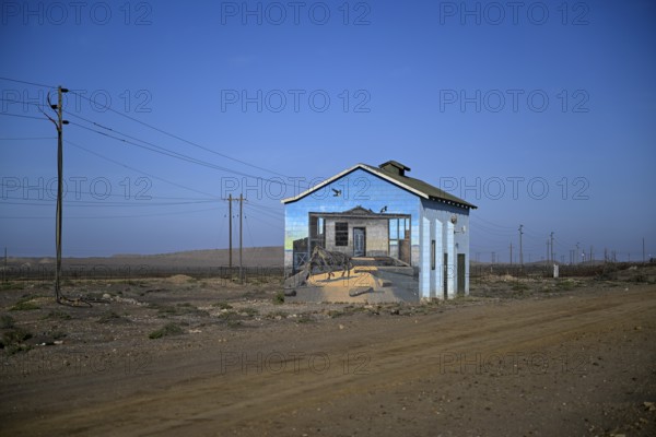 Painted house facade, graffito, brown hyena, diamonds, Oranjemund, Karas region, Namibia