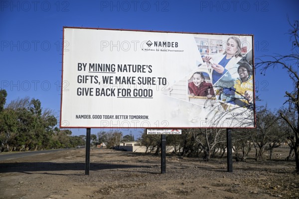 Advertising board of the Namibian diamond company NAMDEB, Oranjemund, diamond restricted area, Karas region, Namibia