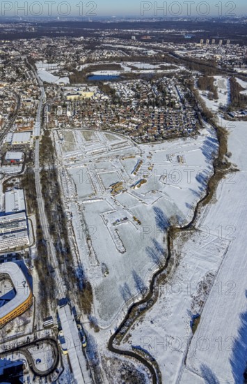 Aerial view, construction area, planned housing estate, Düsseldorfer Landstraße, am Angerbogen, Am Alten Angerbach, Huckingen, Duisburg, Ruhr area, North Rhine-Westphalia, Germany, Angerbogen housing estate, railway tracks, DE, single-family houses, Europe, commercial area, commercial area, commercial park, commercial use, property tax, real estate, Infineon Technologies AG Duisburg, aerial view, aerial photography, aerial photography, snow, overview, bird's-eye view, winter, housing estate, residential development, housing and living, residential area, residential buildings, residential quality, residential neighbourhood, housing estate, Xella Group, birds-eyes view, cleared roads, overview
