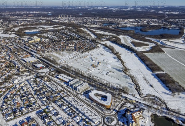 Aerial view, construction area, planned housing estate, Düsseldorfer Landstraße, am Angerbogen, Am Alten Angerbach, Huckingen, Duisburg, Ruhr area, North Rhine-Westphalia, Germany, Angerbogen housing estate, railway tracks, DE, single-family houses, Europe, commercial area, commercial area, commercial park, commercial use, property tax, real estate, Infineon Technologies AG Duisburg, aerial view, aerial photography, aerial photography, snow, overview, bird's-eye view, winter, housing estate, residential development, housing and living, residential area, residential buildings, residential quality, residential neighbourhood, housing estate, Xella Group, birds-eyes view, cleared roads, overview