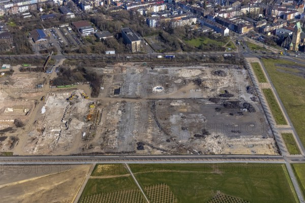 Aerial view, demolition of wire rolling mill for new construction RHEINORT quarter, construction area at Rheinpark Duisburg, Hochfeld, Duisburg, Ruhr area, North Rhine-Westphalia, Germany, construction work, construction, construction area, construction site, building plots, construction project, construction site, DE, Europe, aerial view, aerial photography, aerial photography, new construction, park, overview, bird's-eye view, overview