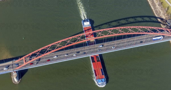 Aerial view, Bridge of Solidarity and container ship on the Rhine, Hochfeld, Duisburg, Ruhr area, North Rhine-Westphalia, Germany, inland navigation, container ships, DE, Europe, freight transport, freight traffic, logistics, aerial view, aerial photography, aerial photography, mortar road, shipping, shipping traffic, overview, bird's-eye view, overview