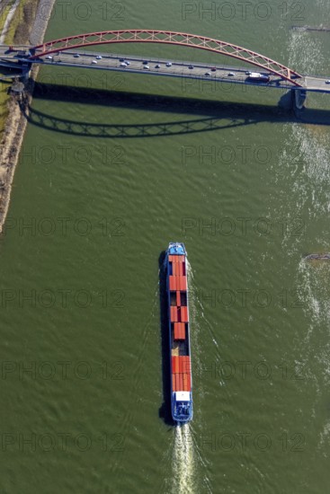 Aerial view, Bridge of Solidarity and container ship on the Rhine, Hochfeld, Duisburg, Ruhr area, North Rhine-Westphalia, Germany, inland navigation, container ships, DE, Europe, freight transport, freight traffic, logistics, aerial view, aerial photography, aerial photography, mortar road, shipping, shipping traffic, overview, bird's-eye view, overview