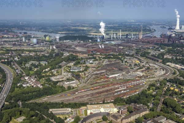 Aerial view, goods train station, thyssenkrupp Steel Europe factory premises, river Rhine with STEAG cogeneration plant Walsum, Marxloh, Duisburg, Ruhr area, North Rhine-Westphalia, Germany, DE, Europe, commercial enterprises, commercial area, commercial park, commercial site, commercial use, greenhouse, industrial area, industrial building, industrial site, power plant, aerial view, aerial photography, aerial photography, aerial photography, overview, bird's-eye view, birds-eyes view, overview