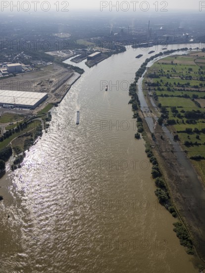 Aerial view, flood river Rhine at logport VI, ferry pier Rhine ferry Walsum, south harbour Walsum, container ships, Qalsum, Orsoy, Rheinberg, Ruhr area, North Rhine-Westphalia, Germany, DE, Europe, flood, flood of the century, aerial view, aerial photography, aerial photography, water level Duisburg, Rhine floodplain, Rhine flood, shipping traffic, heavy rain, overview, bird's-eye view, logport 6, logport VI, overview, flooding