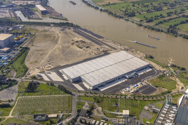 Aerial view, STEAG cogeneration plant Walsum, development and new warehouses logport VI, river Rhine, Alt-Walsum, Duisburg, Ruhr area, North Rhine-Westphalia, Germany, construction work, construction area, construction site, building plots, construction project, construction site, DE, development, Europe, industrial area, commercial area, commercial use, cogeneration plant, industrial facilities, industrial area, industrial site, capacity requirements, aerial view, aerial photography, aerial photography, new construction, overview, bird's-eye view, birds-eyes view, former Walsum colliery, logport VI, overview