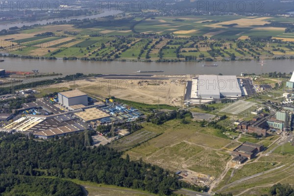 Aerial view, STEAG cogeneration plant Walsum, development and new warehouses logport VI, river Rhine, Alt-Walsum, Duisburg, Ruhr area, North Rhine-Westphalia, Germany, construction work, construction area, construction site, building plots, construction project, construction site, DE, development, Europe, industrial area, commercial area, commercial use, cogeneration plant, industrial facilities, industrial area, industrial site, capacity requirements, aerial view, aerial photography, aerial photography, new construction, overview, bird's-eye view, birds-eyes view, former Walsum colliery, logport VI, overview