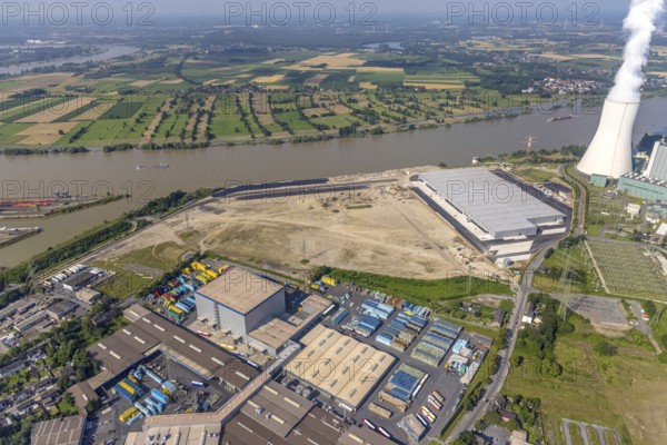Aerial view, STEAG cogeneration plant Walsum, development and new warehouses logport VI, river Rhine, Alt-Walsum, Duisburg, Ruhr area, North Rhine-Westphalia, Germany, construction work, construction area, construction site, building plots, construction project, construction site, DE, development, Europe, industrial area, commercial area, commercial use, cogeneration plant, industrial facilities, industrial area, industrial site, capacity requirements, aerial view, aerial photography, aerial photography, new construction, overview, bird's-eye view, birds-eyes view, former Walsum colliery, logport VI, overview