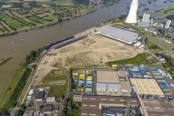 Aerial view, STEAG cogeneration plant Walsum, development and new warehouses logport VI, river Rhine, Alt-Walsum, Duisburg, Ruhr area, North Rhine-Westphalia, Germany, construction work, construction area, construction site, building plots, construction project, construction site, DE, development, Europe, industrial area, commercial area, commercial use, cogeneration plant, industrial facilities, industrial area, industrial site, capacity requirements, aerial view, aerial photography, aerial photography, new construction, overview, bird's-eye view, birds-eyes view, former Walsum colliery, logport VI, overview