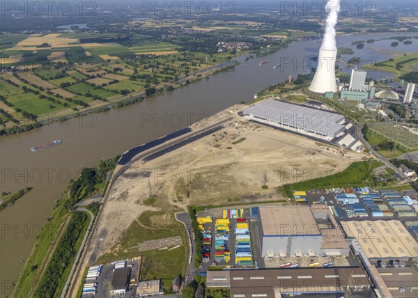 Aerial view, STEAG cogeneration plant Walsum, development and new warehouses logport VI, river Rhine, Alt-Walsum, Duisburg, Ruhr area, North Rhine-Westphalia, Germany, construction work, construction area, construction site, building plots, construction project, construction site, DE, development, Europe, industrial area, commercial area, commercial use, cogeneration plant, industrial facilities, industrial area, industrial site, capacity requirements, aerial view, aerial photography, aerial photography, new construction, overview, bird's-eye view, birds-eyes view, former Walsum colliery, logport VI, overview