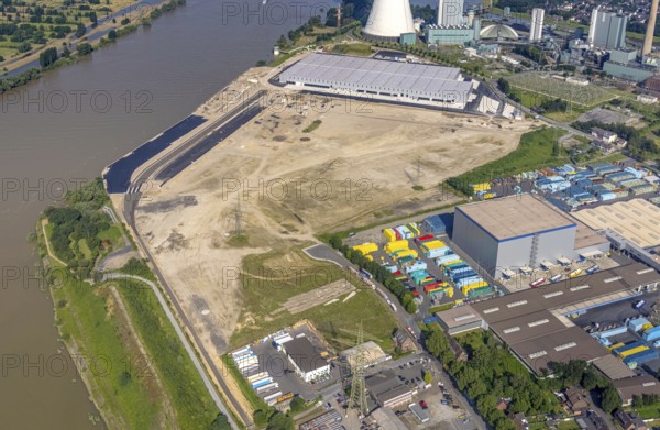 Aerial view, STEAG cogeneration plant Walsum, development and new warehouses logport VI, river Rhine, Alt-Walsum, Duisburg, Ruhr area, North Rhine-Westphalia, Germany, construction work, construction area, construction site, building plots, construction project, construction site, DE, development, Europe, industrial area, commercial area, commercial use, cogeneration plant, industrial facilities, industrial area, industrial site, capacity requirements, aerial view, aerial photography, aerial photography, new construction, overview, bird's-eye view, birds-eyes view, former Walsum colliery, logport VI, overview