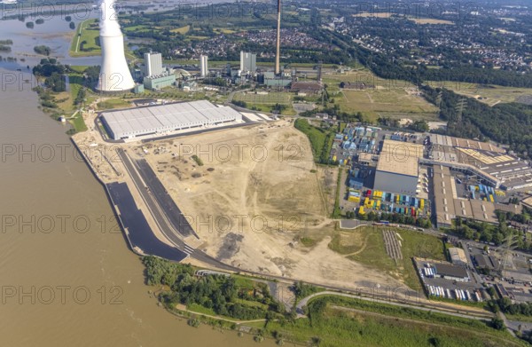 Aerial view, STEAG cogeneration plant Walsum, development and new warehouses logport VI, river Rhine, Alt-Walsum, Duisburg, Ruhr area, North Rhine-Westphalia, Germany, construction work, construction area, construction site, building plots, construction project, construction site, DE, development, Europe, industrial area, commercial area, commercial use, cogeneration plant, industrial facilities, industrial area, industrial site, capacity requirements, aerial view, aerial photography, aerial photography, new construction, overview, bird's-eye view, birds-eyes view, former Walsum colliery, logport VI, overview