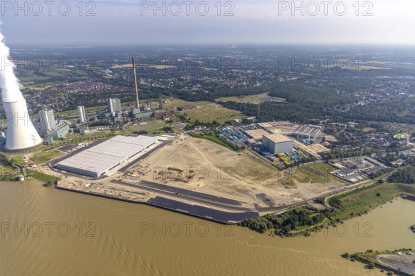 Aerial view, STEAG cogeneration plant Walsum, development and new warehouses logport VI, river Rhine, Alt-Walsum, Duisburg, Ruhr area, North Rhine-Westphalia, Germany, construction work, construction area, construction site, building plots, construction project, construction site, DE, development, Europe, industrial area, commercial area, commercial use, cogeneration plant, industrial facilities, industrial area, industrial site, capacity requirements, aerial view, aerial photography, aerial photography, new construction, overview, bird's-eye view, birds-eyes view, former Walsum colliery, logport VI, overview