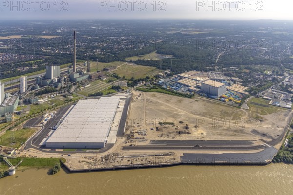 Aerial view, STEAG cogeneration plant Walsum, development and new warehouses logport VI, river Rhine, Alt-Walsum, Duisburg, Ruhr area, North Rhine-Westphalia, Germany, construction work, construction area, construction site, building plots, construction project, construction site, DE, development, Europe, industrial area, commercial area, commercial use, cogeneration plant, industrial facilities, industrial area, industrial site, capacity requirements, aerial view, aerial photography, aerial photography, new construction, overview, bird's-eye view, birds-eyes view, former Walsum colliery, logport VI, overview