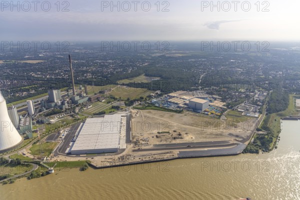 Aerial view, STEAG cogeneration plant Walsum, development and new warehouses logport VI, river Rhine, Alt-Walsum, Duisburg, Ruhr area, North Rhine-Westphalia, Germany, construction work, construction area, construction site, building plots, construction project, construction site, DE, development, Europe, industrial area, commercial area, commercial use, cogeneration plant, industrial facilities, industrial area, industrial site, capacity requirements, aerial view, aerial photography, aerial photography, new construction, overview, bird's-eye view, birds-eyes view, former Walsum colliery, logport VI, overview