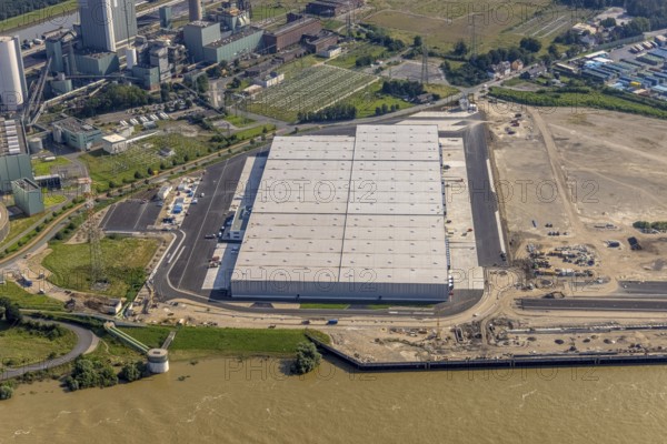 Aerial view, STEAG cogeneration plant Walsum, development and new warehouses logport VI, river Rhine, Alt-Walsum, Duisburg, Ruhr area, North Rhine-Westphalia, Germany, construction work, construction area, construction site, building plots, construction project, construction site, DE, development, Europe, industrial area, commercial area, commercial use, cogeneration plant, industrial facilities, industrial area, industrial site, capacity requirements, aerial view, aerial photography, aerial photography, new construction, overview, bird's-eye view, birds-eyes view, former Walsum colliery, logport VI, overview