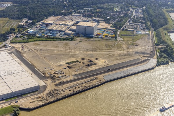Aerial view, STEAG cogeneration plant Walsum, development and new warehouses logport VI, river Rhine, Alt-Walsum, Duisburg, Ruhr area, North Rhine-Westphalia, Germany, construction work, construction area, construction site, building plots, construction project, construction site, DE, development, Europe, industrial area, commercial area, commercial use, cogeneration plant, industrial facilities, industrial area, industrial site, capacity requirements, aerial view, aerial photography, aerial photography, new construction, overview, bird's-eye view, birds-eyes view, former Walsum colliery, logport VI, overview