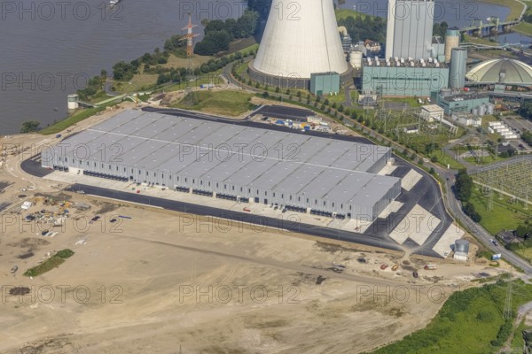 Aerial view, STEAG cogeneration plant Walsum, development and new warehouses logport VI, river Rhine, Alt-Walsum, Duisburg, Ruhr area, North Rhine-Westphalia, Germany, construction work, construction area, construction site, building plots, construction project, construction site, DE, development, Europe, industrial area, commercial area, commercial use, cogeneration plant, industrial facilities, industrial area, industrial site, capacity requirements, aerial view, aerial photography, aerial photography, new construction, overview, bird's-eye view, birds-eyes view, former Walsum colliery, logport VI, overview