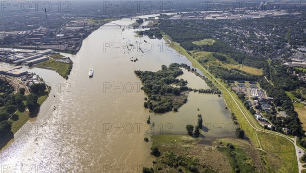 Aerial view, flood river Rhine, entrance to the outer harbour, flooding Rheinwiesen Rheinhausen and NSG Werthauser Wardt, sewage treatment plant Duisburg Rheinhausen, Bergheim, Duisburg, Ruhr area, North Rhine-Westphalia, Germany, DE, Europe, harbour, flood, flood of the century, aerial view, aerial photography, aerial photography, nature reserve, water level Duisburg, Rhine flood, heavy rain, overview, bird's eye view, overview, flooding