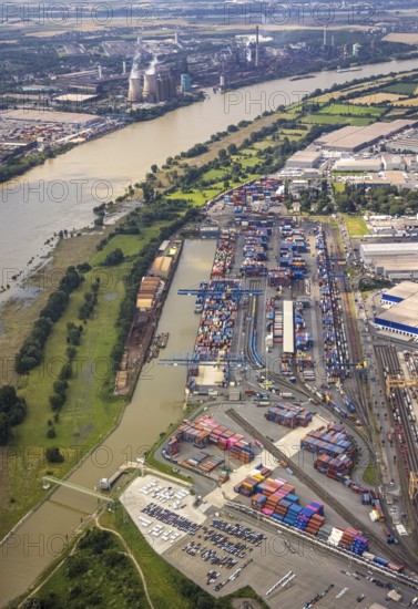 Aerial view, flood river Rhine, logport I, logistics terminal, container port, automobile logistics, Wanheimerort, Duisburg, Ruhr area, North Rhine-Westphalia, Germany, D3T Duisburg Trimodal Terminal, DE, Europe, flood, flood of the century, logistics, logistics service, logistics service provider, logistics provider, logistics centre, aerial view, aerial photography, aerial photography, Duisburg water level, Rhine flood, heavy rain, terminal, transport service, overview, bird's-eye view, bird's-eye view, logport 1, overview, flooding